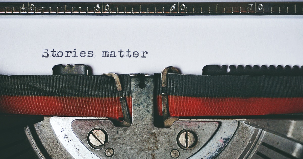 Typewriter with words stories matter typed on paper
